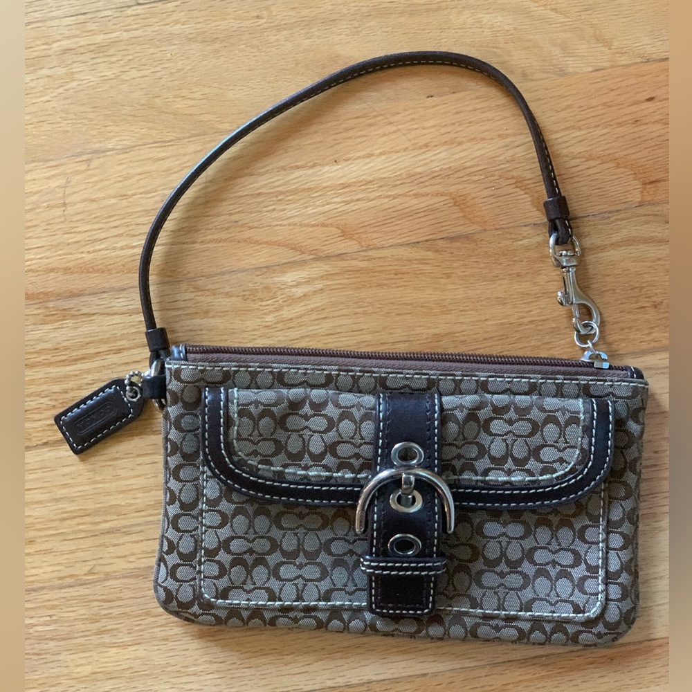 Coach signature soho buckle wristlet in brown canvas with leather accents